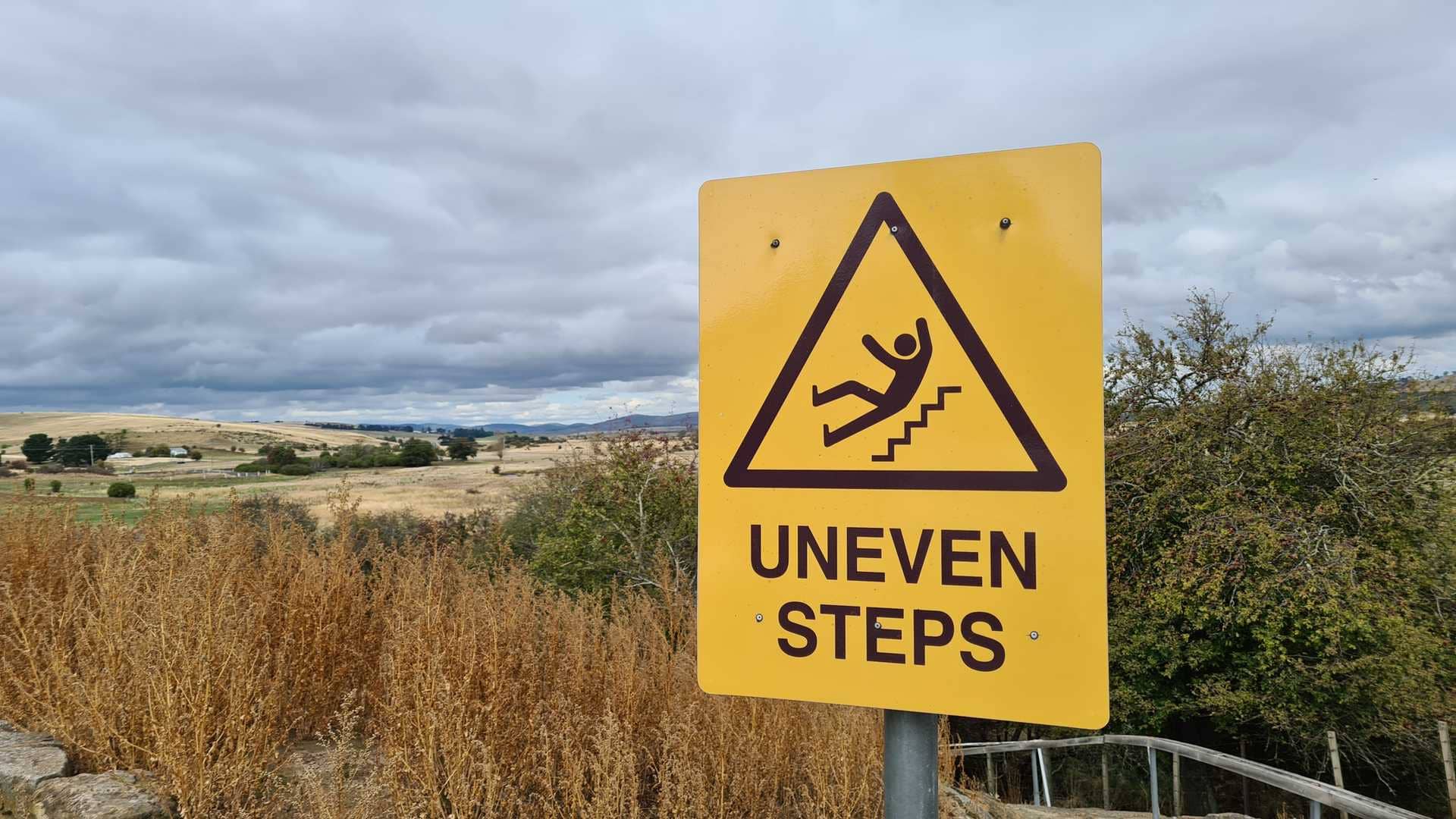 Uneven steps with man slipping for Personal Injury Cases We Handle in Hawaii